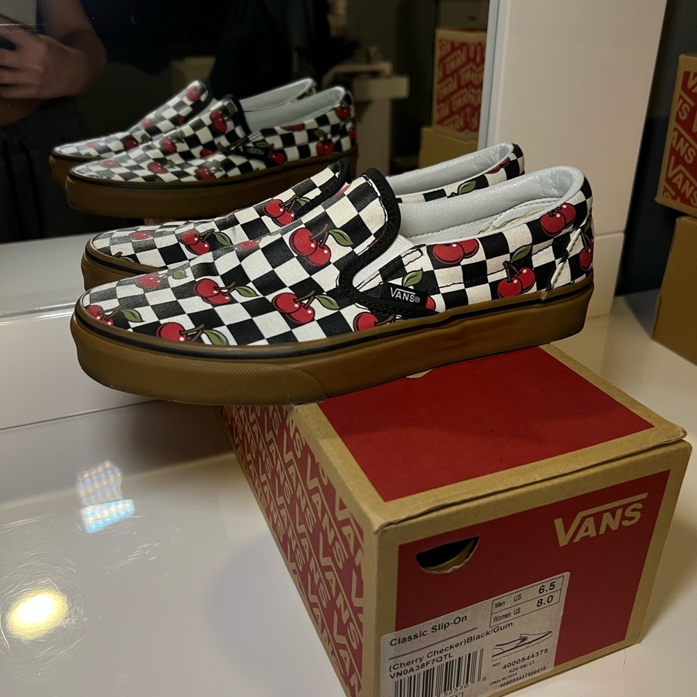 Vans Black and White Cherry Slip-On Sneakers
